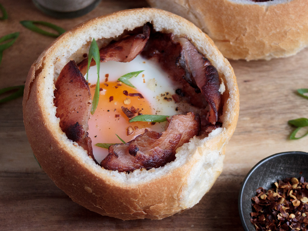 Baked bread bowl with bacon and egg